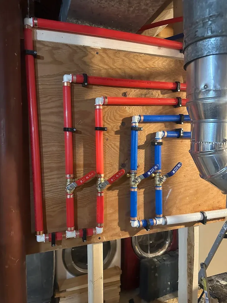 A wrench resting beside a metal pipe ready for repair